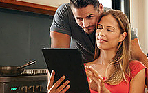 Young couple watching a tablet